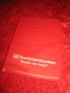 Plastomslag til timeplan innlagt, fra Sunnmørsbanken. 80 tallet.