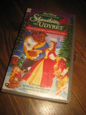 SKJØNNHETEN OG UDYRET. DEN FORTRYLLENDE JULEN.