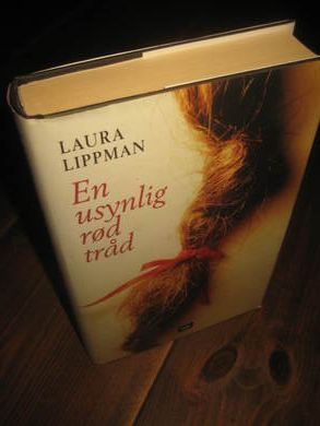 LIPPMAN LAURA: EN USYNLIG R&Oslash;D TR&Aring;D 2004