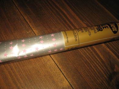 Uåpna rull julepapir fra 80 tallet 2 5 meter stjerner på grå bakgrunn dette er rull nr 12