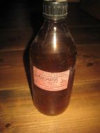 Flaske uten innhold SALMIAKSPIRITUS fra Storfjord Apotek Stranda 50-60 tallet Ca 20 cm høg