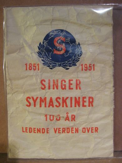 Papirpose med reklame for SINGER 1951