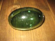 Pen oval kavlkule uten seis Tuppen på ene side har gått innover og ligg inni kula Gammel