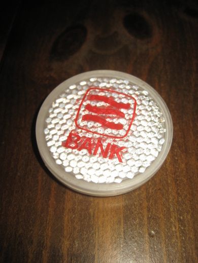 Refleksbrikke med reklame fra SUNNMØRSBANKEN? 70 tallet