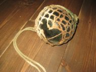 Kavlkule med skade brukt ved garnfiske i gamle dager Fra forige århundreskifte Ca 12 cm i diameter mørk grønn
