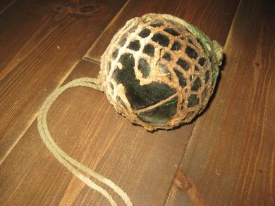 Kavlkule med skade brukt ved garnfiske i gamle dager Fra forige århundreskifte Ca 12 cm i diameter mørk grønn