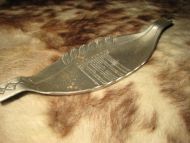 Tinn vikingskip, ca 30 cm langt. 