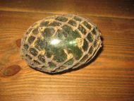 Oval tjukk kavlkule med netting ca 10 cm i diameter brukt ved garnfiske i gamle dager fra starten på 1900 Pen seis med liten skade