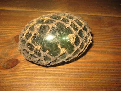 Oval tjukk kavlkule med netting ca 10 cm i diameter brukt ved garnfiske i gamle dager fra starten på 1900 Pen seis med liten skade